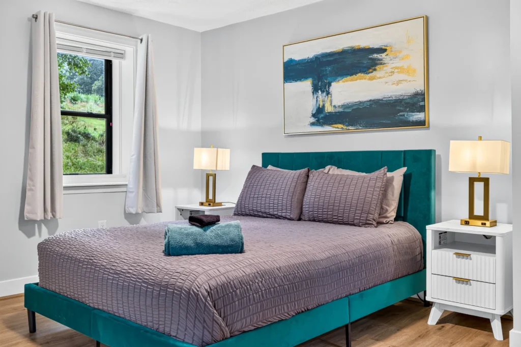 Queen bedroom with teal headboard