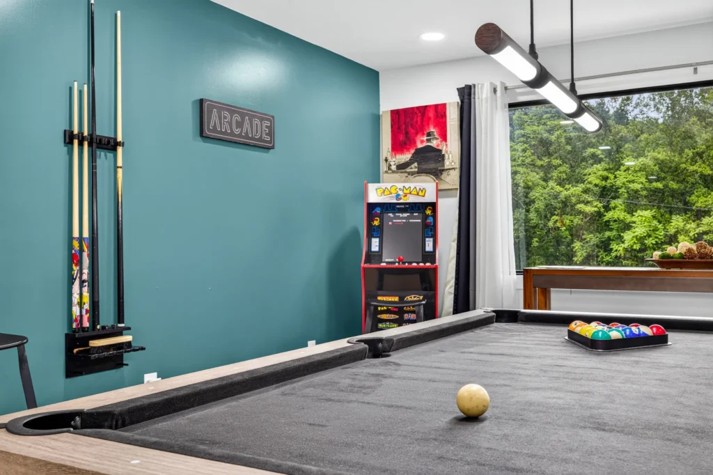 Arcade and game room with pool table